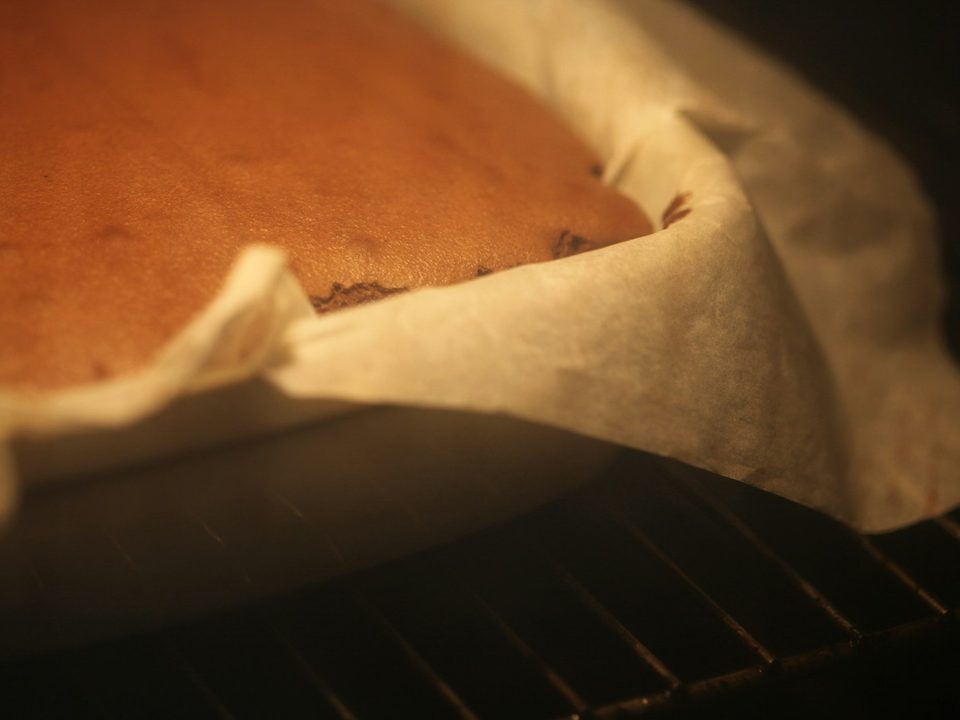 Picture 2: A cake baking in an oven on a rack